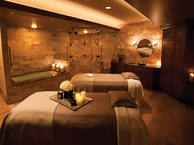 A tranquil, modern spa room with soft lighting.